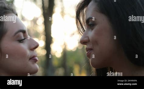 lesbian 4k|Two girls french kissing outside at the park. LGBT lesbian couple。